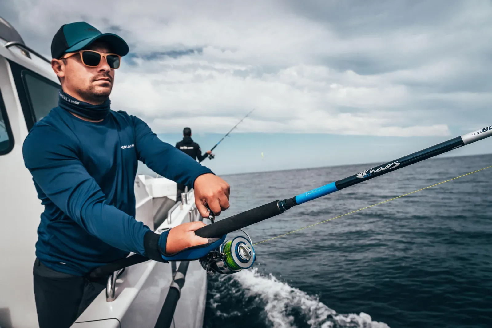 Angler holding a spinning rod on a moving boat