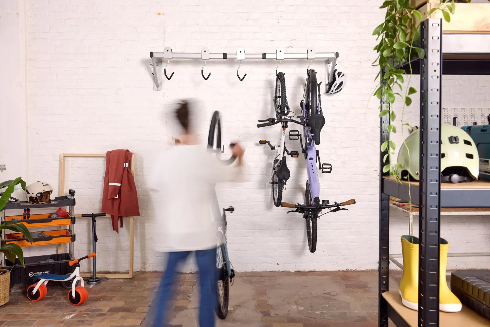 Home garage with bikes hung on a wall rack